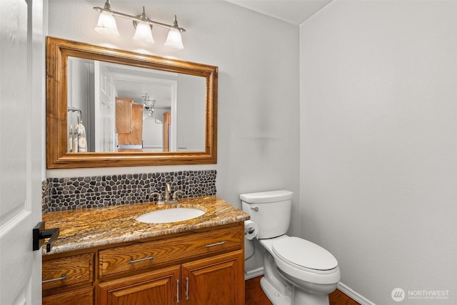 4618 51st Street Ct E, Tacoma, WA 98443 - bathroom with vanity, decorative backsplash, and wood finished floors