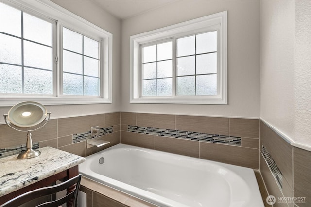 4618 51st Street Ct E, Tacoma, WA 98443 - full bath with tile walls, a garden tub, vanity, and a wainscoted wall