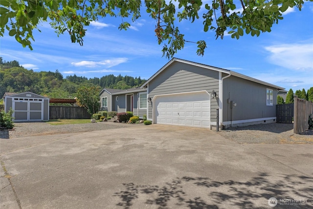 209 4th Ave N, Algona, WA 98001 - view of front of home with concrete driveway, a garage, and a storage unit