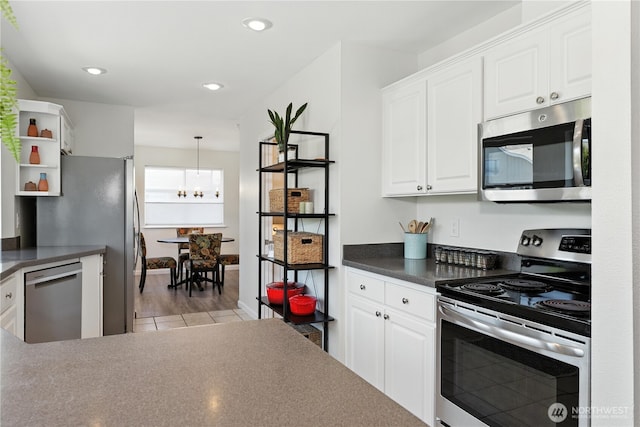 209 4th Ave N, Algona, WA 98001 - kitchen featuring stainless steel appliances, white cabinetry, dark countertops, open shelves, and recessed lighting