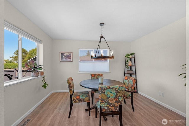 209 4th Ave N, Algona, WA 98001 - dining area featuring light wood-type flooring and baseboards