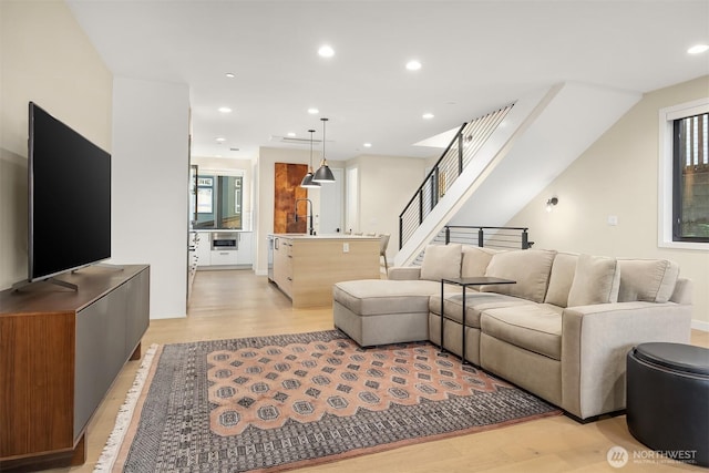 330 3rd Ave S Unit C, Kirkland, WA 98033 - living room featuring light wood finished floors, recessed lighting, and stairs