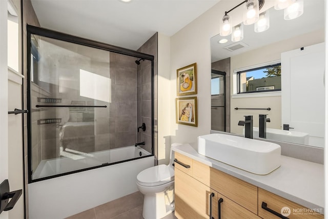 330 3rd Ave S Unit C, Kirkland, WA 98033 - bathroom featuring vanity, bath / shower combo with glass door, and tile patterned floors