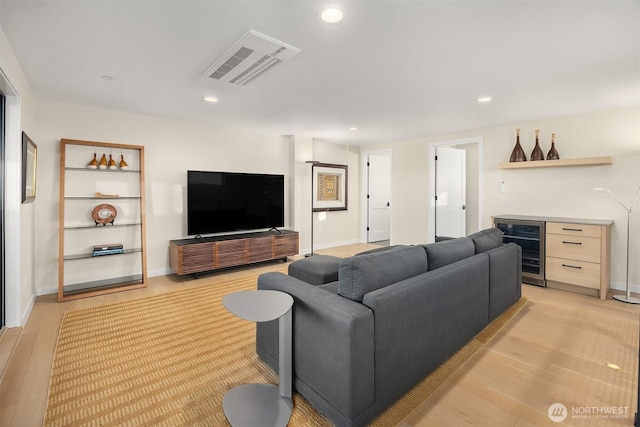 330 3rd Ave S Unit C, Kirkland, WA 98033 - living room featuring beverage cooler, recessed lighting, light wood-style flooring, and a bar
