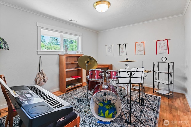 541 75th Way NE, Olympia, WA 98506 - recreation room featuring wood finished floors, crown molding, and a desk