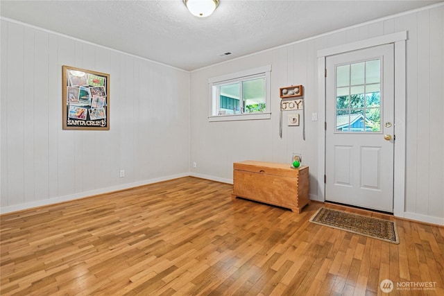 541 75th Way NE, Olympia, WA 98506 - foyer entrance featuring healthy amount of natural light, light wood-style flooring, ornamental molding, and a textured ceiling