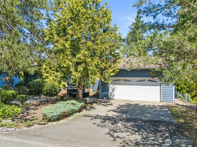 21410 SE 265th Pl, Maple Valley, WA 98038 - obstructed view of property with concrete driveway