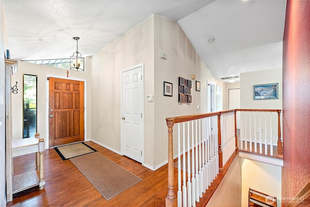 21410 SE 265th Pl, Maple Valley, WA 98038 - entrance foyer featuring vaulted ceiling and wood finished floors