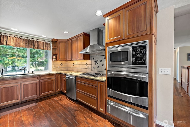 21410 SE 265th Pl, Maple Valley, WA 98038 - kitchen featuring a warming drawer, appliances with stainless steel finishes, wall chimney range hood, dark wood finished floors, and light stone counters
