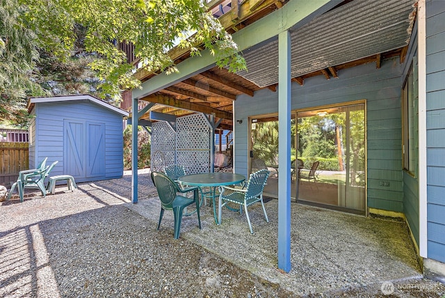 21410 SE 265th Pl, Maple Valley, WA 98038 - view of patio with a storage unit and outdoor dining space