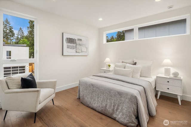 3968 162nd Pl SE, Bellevue, WA 98006 - bedroom featuring wood finished floors, multiple windows, and recessed lighting