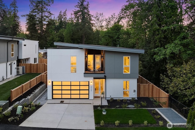 3968 162nd Pl SE, Bellevue, WA 98006 - modern home featuring concrete driveway, an attached garage, and a balcony