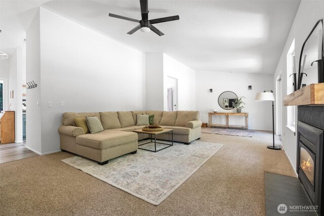 5414 70th Ave NE, Olympia, WA 98516 - living room with carpet floors, a fireplace with flush hearth, a ceiling fan, and vaulted ceiling