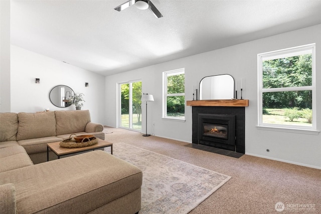 5414 70th Ave NE, Olympia, WA 98516 - carpeted living room with a fireplace with flush hearth, a ceiling fan, and vaulted ceiling
