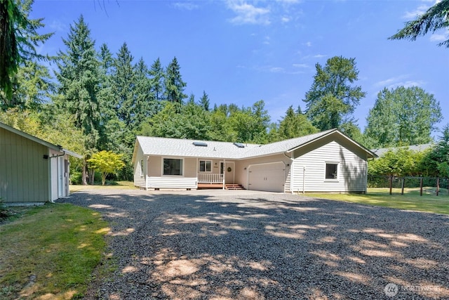 5414 70th Ave NE, Olympia, WA 98516 - view of front facade featuring an attached garage and gravel driveway