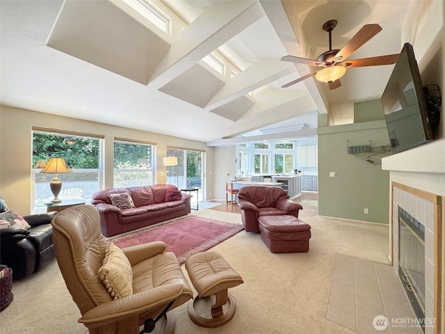 77 A Rd, Less Traveled, Sequim, WA 98382 - living area with light carpet, a tile fireplace, plenty of natural light, and a ceiling fan