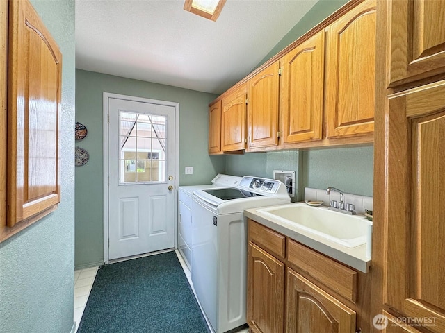 77 A Rd, Less Traveled, Sequim, WA 98382 - laundry room with cabinet space, washing machine and dryer, a textured ceiling, and light tile patterned floors
