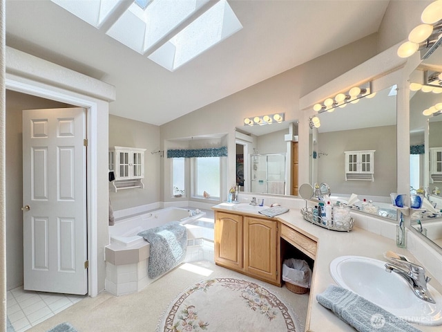 77 A Rd, Less Traveled, Sequim, WA 98382 - full bath with a garden tub, a stall shower, double vanity, a skylight, and vaulted ceiling