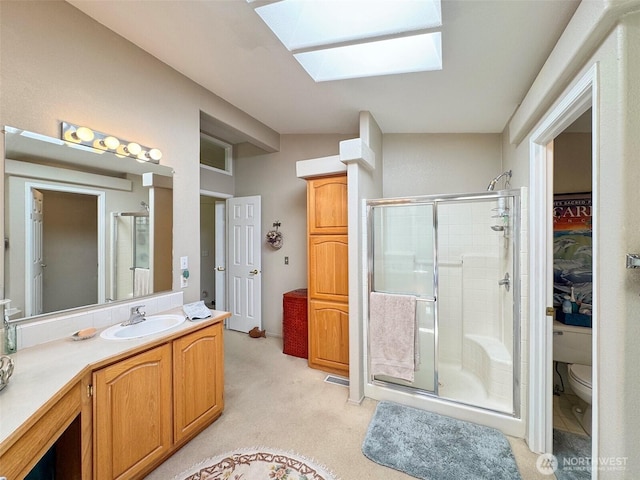 77 A Rd, Less Traveled, Sequim, WA 98382 - full bath featuring a shower stall, a skylight, and vanity