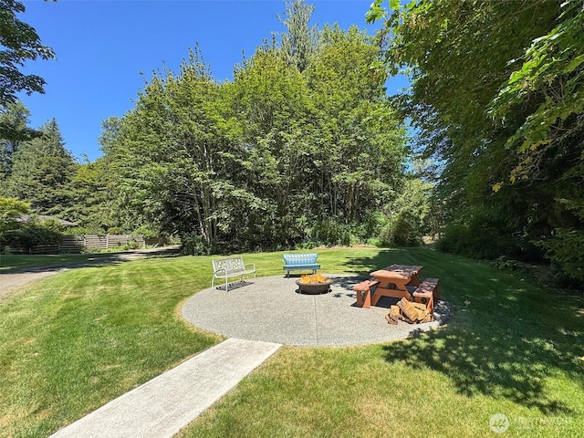 77 A Rd, Less Traveled, Sequim, WA 98382 - view of green lawn featuring an outdoor fire pit and a patio