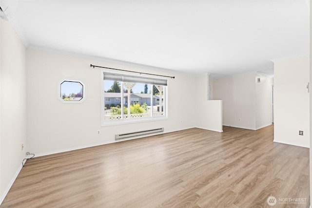2512 Columbus Ave, Port Angeles, WA 98362 - unfurnished room with a baseboard heating unit, ornamental molding, and light wood-type flooring