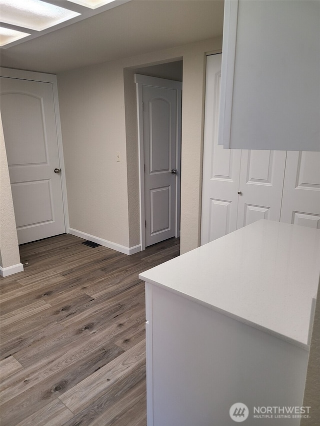 118 17th Ave SE, Olympia, WA 98501 - corridor with dark wood-type flooring and baseboards