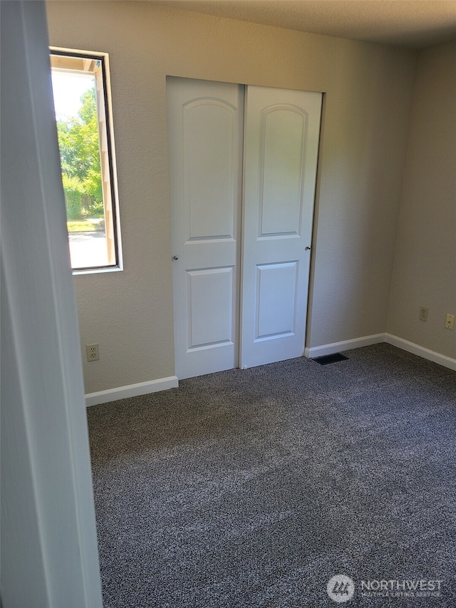 118 17th Ave SE, Olympia, WA 98501 - unfurnished bedroom featuring carpet flooring and a closet