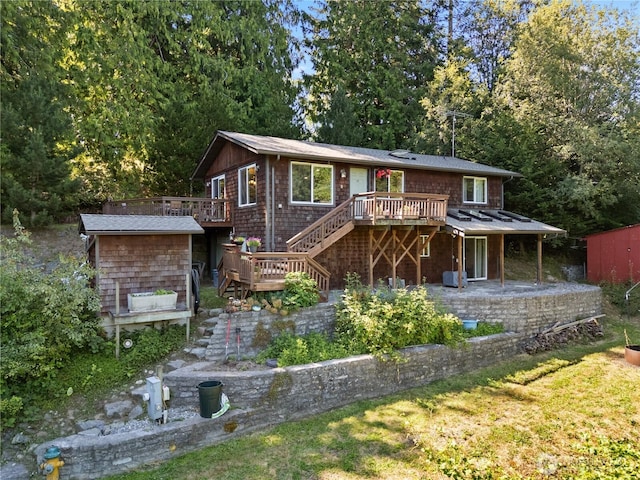 14068 Crater Lake Rd, Anacortes, WA 98221 - view of front facade with stairs, a deck, a shed, and a patio
