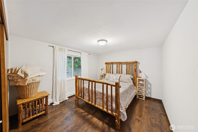 14068 Crater Lake Rd, Anacortes, WA 98221 - bedroom with wood finished floors and a baseboard heating unit