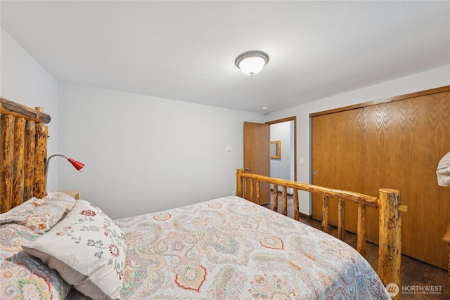 14068 Crater Lake Rd, Anacortes, WA 98221 - bedroom featuring wood finished floors and a closet