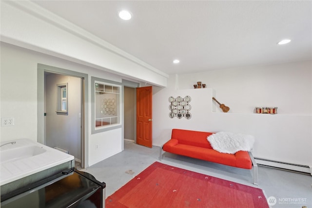14068 Crater Lake Rd, Anacortes, WA 98221 - living area with a baseboard heating unit, recessed lighting, and concrete flooring