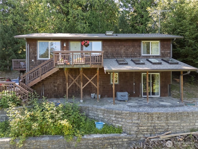 14068 Crater Lake Rd, Anacortes, WA 98221 - rear view of property featuring stairs, a patio, a wooden deck, and a shingled roof