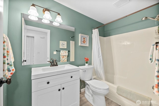 303 Kenyon St NW Unit 2D, Olympia, WA 98502 - bathroom featuring vanity, wood finished floors, and shower / bath combo