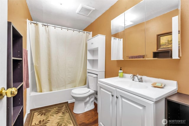 8310 207th St E, Spanaway, WA 98387 - bathroom featuring vanity, wood finished floors, and shower / tub combo with curtain