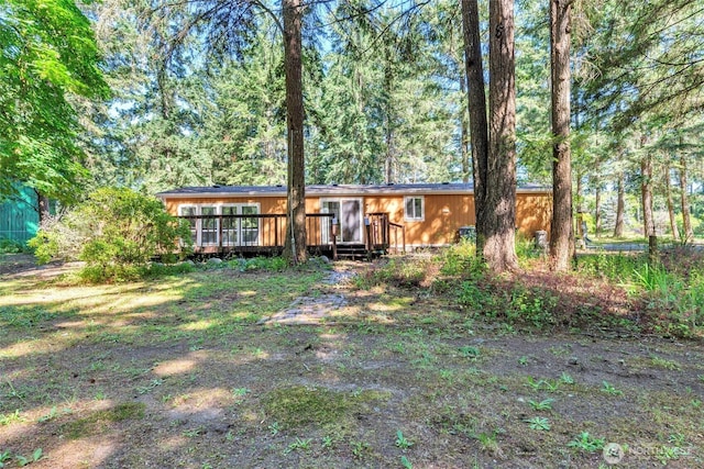 8310 207th St E, Spanaway, WA 98387 - ranch-style home featuring a wooden deck