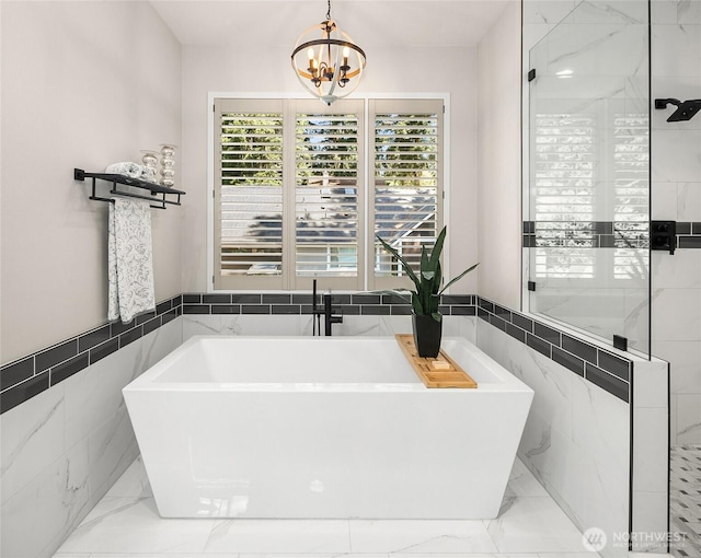 16671 SE 17th Pl, Bellevue, WA 98008 - full bath featuring a freestanding tub, plenty of natural light, tile walls, a chandelier, and marble finish floors