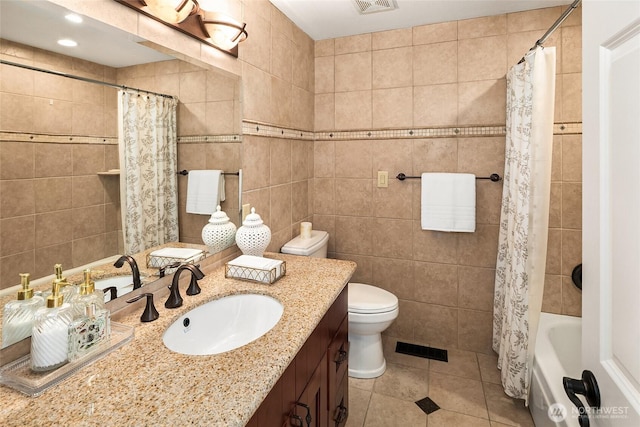 16671 SE 17th Pl, Bellevue, WA 98008 - full bath with vanity, tile walls, tile patterned floors, and shower / bath combo