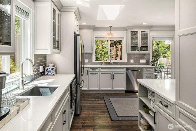 16671 SE 17th Pl, Bellevue, WA 98008 - kitchen with appliances with stainless steel finishes, a skylight, recessed lighting, and backsplash