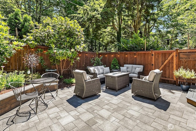 16671 SE 17th Pl, Bellevue, WA 98008 - fenced backyard featuring an outdoor living space with a fire pit and a patio area
