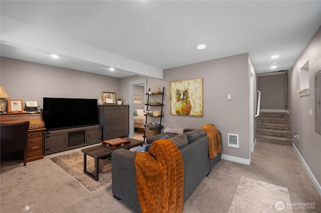 22305 Autumnwood Ct SE, Yelm, WA 98597 - living room featuring light carpet, recessed lighting, and stairs