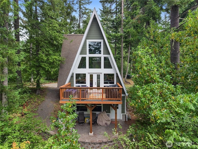 22305 Autumnwood Ct SE, Yelm, WA 98597 - rear view of property with a wooden deck, french doors, and roof with shingles