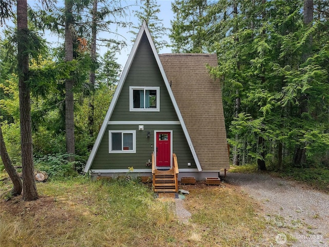 22305 Autumnwood Ct SE, Yelm, WA 98597 - a-frame home with a shingled roof and gravel driveway