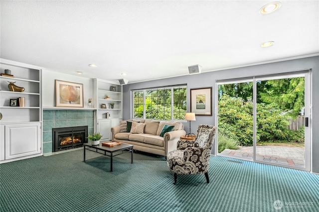 1023 144th Pl SE, Bellevue, WA 98007 - carpeted living room with a fireplace, recessed lighting, and built in shelves
