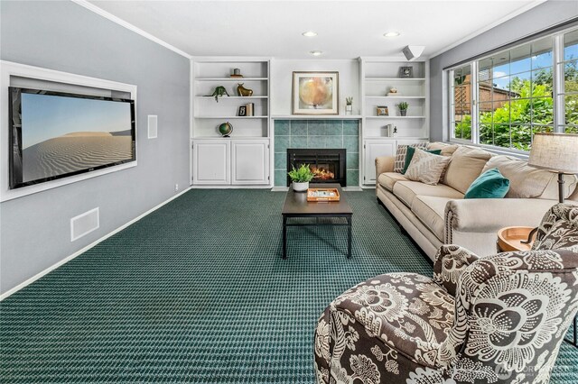 1023 144th Pl SE, Bellevue, WA 98007 - living area with dark colored carpet, a tiled fireplace, crown molding, built in features, and recessed lighting