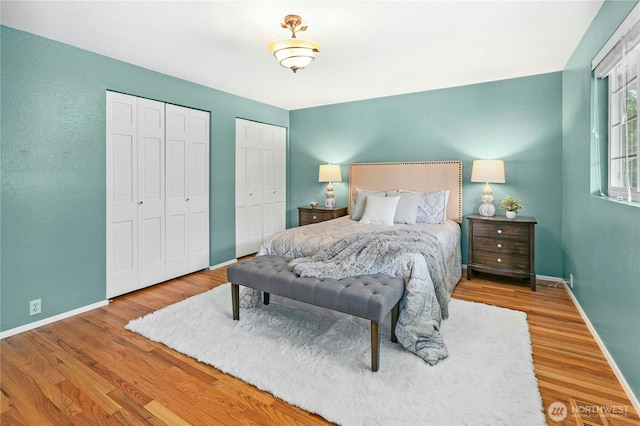 1023 144th Pl SE, Bellevue, WA 98007 - bedroom with multiple closets and wood finished floors