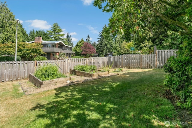 1023 144th Pl SE, Bellevue, WA 98007 - fenced backyard with a garden