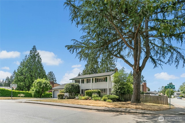 1023 144th Pl SE, Bellevue, WA 98007 - view of front of home featuring a chimney
