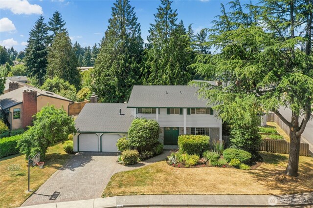 1023 144th Pl SE, Bellevue, WA 98007 - view of front facade featuring driveway and a garage