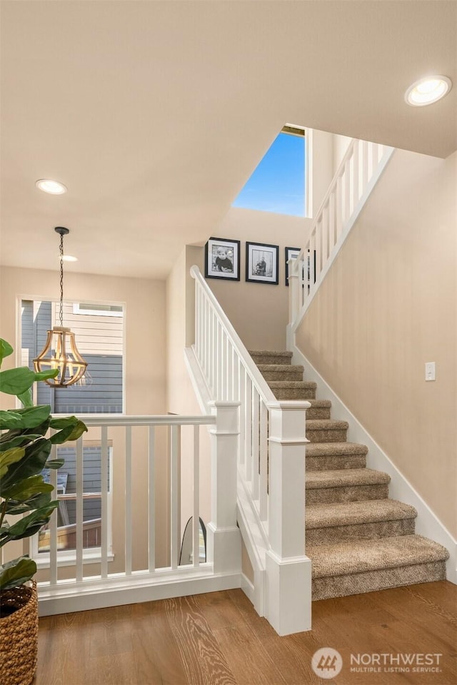 28621 NE 156th St, Duvall, WA 98019 - stairway featuring a chandelier, recessed lighting, and wood finished floors