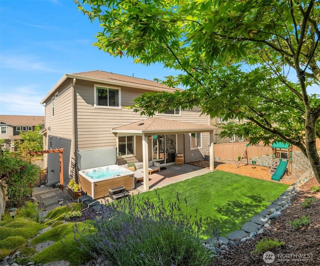 28621 NE 156th St, Duvall, WA 98019 - rear view of house with a patio, a playground, a fenced backyard, a hot tub, and an outdoor hangout area